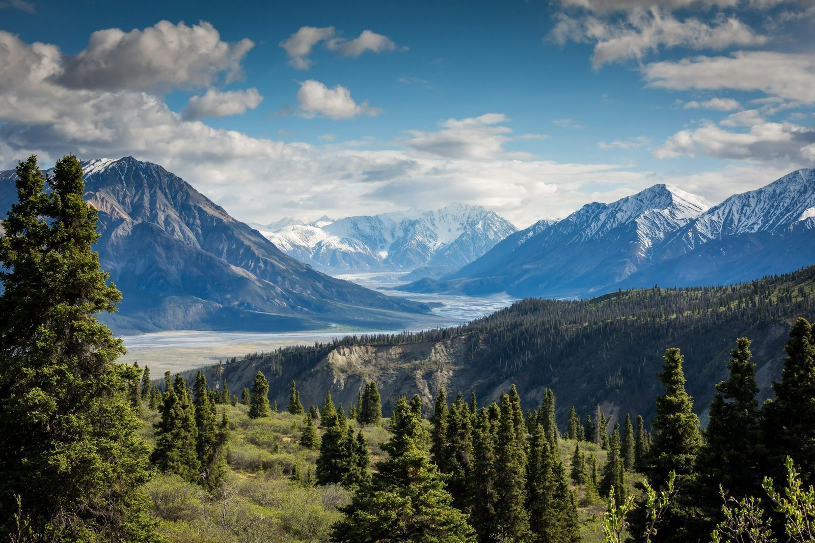 Mountain range under cloud — the operational standard we hold.